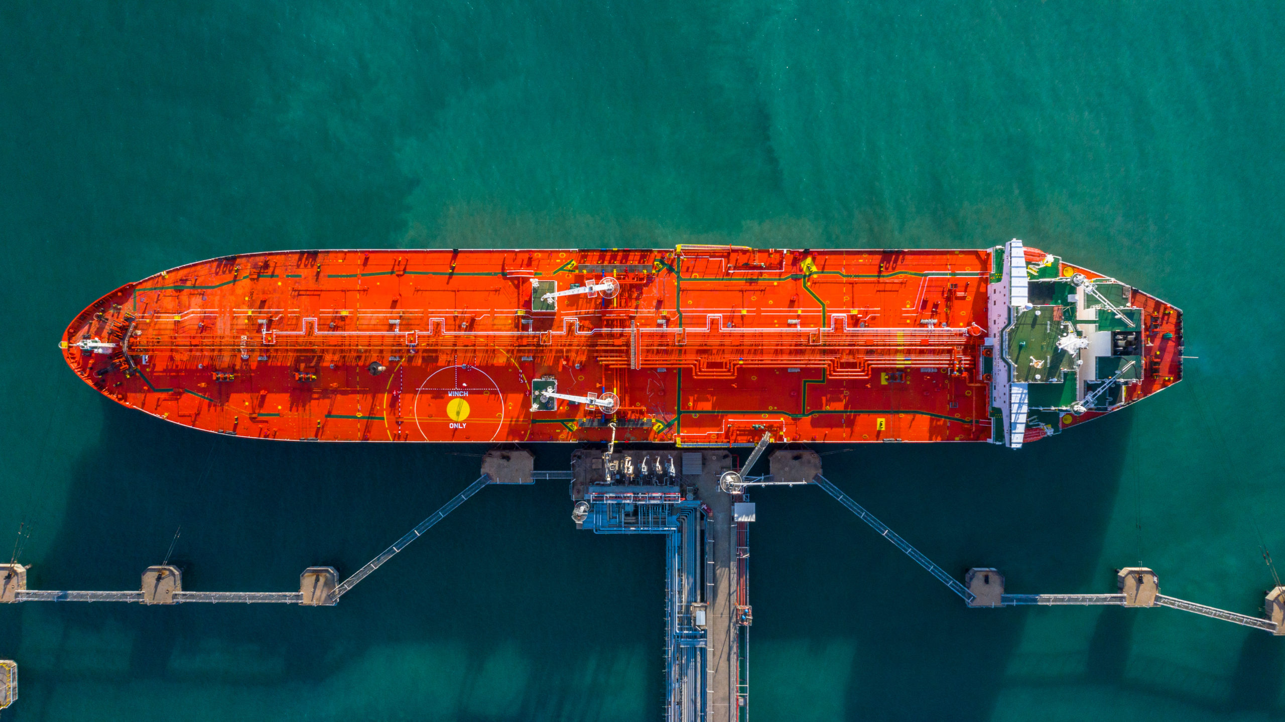 aerial view of tanker ship vessel unloading at business port