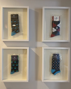 wall display of 4 sock styles from Transparensea Fuels